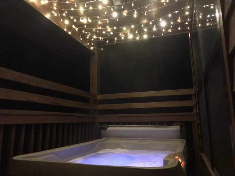 The hot tub gets even more magical at night, when the fairy lights are on! The hot tub is covered, so even if it's raining, you can be toasty warm.